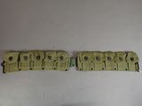 an image of a pair of belt straps with buttons on them