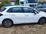 a white car that is parked in a lot