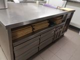 a large stainless steel counter in a commercial kitchen