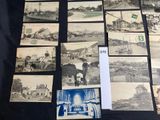 a lot of old black and white photos on the table