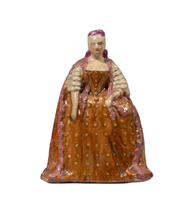 an image of a figurine of a woman sitting on a chair