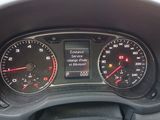 a close up of a car dashboard with a speedometer and gauges
