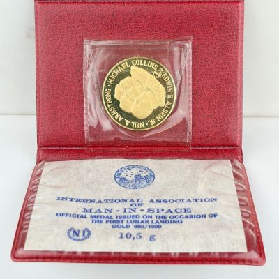 an image of a red case with a gold coin in it