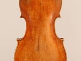 an old violin with a wooden back and a long neck