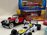 four toy cars that are sitting next to each other