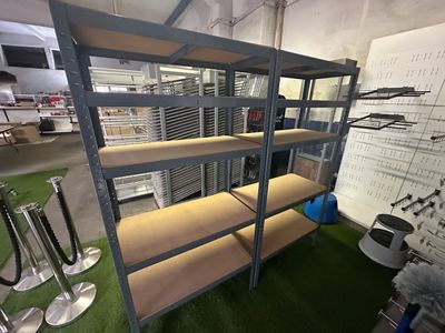 a room with a bunch of shelves and a lot of tools