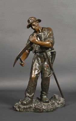 bronze statue of a man with a gun and a rifle