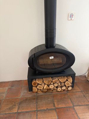 a wood burning stove in the corner of a room