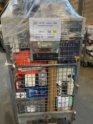 a metal cart with a sign on it in a warehouse