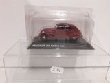 a red toy car in a clear display case