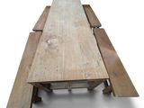an image of a wooden table with two benches underneath it