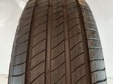 a close up of a car tire on a white surface