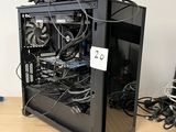 a black computer case sitting on top of a wooden table