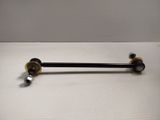 a close up of a black and gold handle on a white table