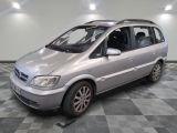 a silver car that is parked on a checkered floor