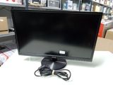 a computer monitor sitting on a table in a store