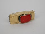 yellow and red toy car on white surface with white background