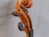 an old violin with a wooden back and bow on a white background