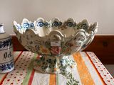 a large bowl on a table with a striped tablecloth
