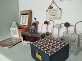 a box of donuts sitting on a counter next to other items