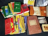 many books that are sitting on a black table