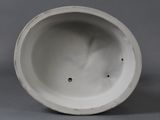 a white vase with a hole in the middle of it