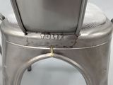 a close up of a metal chair on a white surface