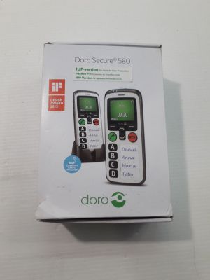 a box with two cell phones in it on a table