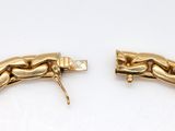 two gold bracelets with links and a clasp on them