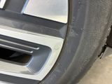 a close up of a car ' s front bumper with a hole in the center