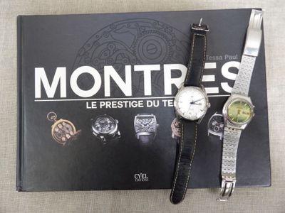 a book with a watch and a book with a picture on it