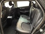 the back seats of a car are empty and the passenger seat is empty