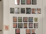 a picture of a collection of stamps displayed on a wall