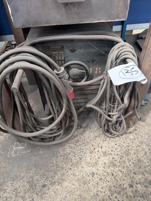 a lot of wires and a machine on the floor