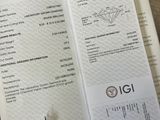 a receipt with a diamond on it sitting on a table