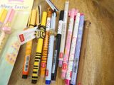 a lot of pens that are sitting on a table