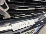 a close up of a car ' s front grill with a sticker on it