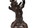 sculpture of a tree trunk with a branch sticking out of it ' s trunk