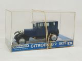 a blue toy car in a clear box