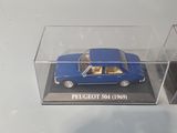 a blue toy car in a clear box on a white table