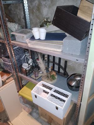 a shelf with many items on it in a room