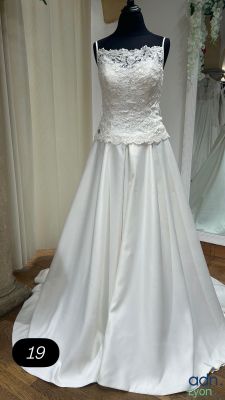 the wedding dress is on a mannequin display in the store