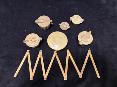 a group of gold coins sitting on top of a black table