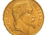 a close up of a gold coin with a woman ' s face