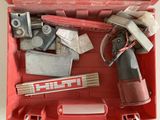 a red tool box with tools in it on a table
