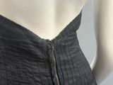 a close up of a woman ' s dress with a zipper on it