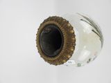 a white vase with a gold rim and a black lid