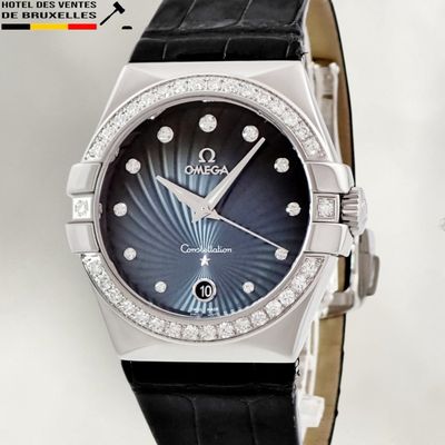 an image of a close up of a watch with diamonds on it