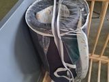 a bag that is sitting on a bench next to a chair