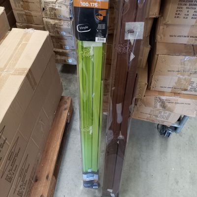 a green stalk of celery in the middle of a pile of boxes